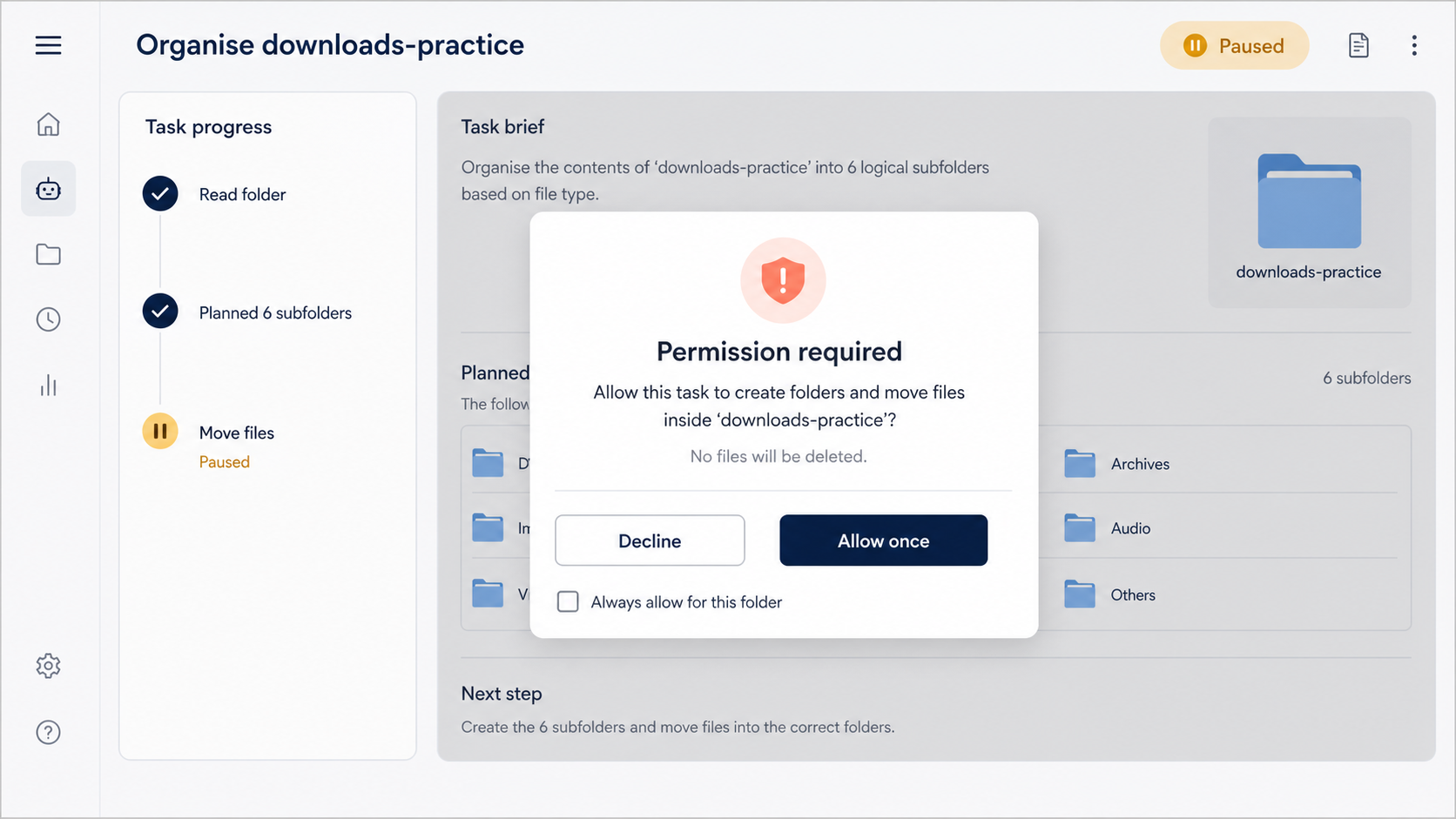 Illustrative folder-organising task paused at a permission prompt before moving files